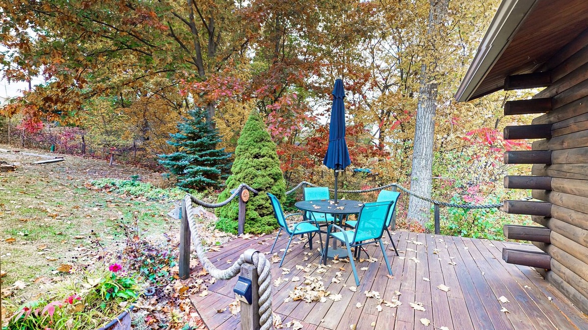 Valois House | 1-acre lakefront log cabin with dock, 50 ft water frontage, hot tub, & deck