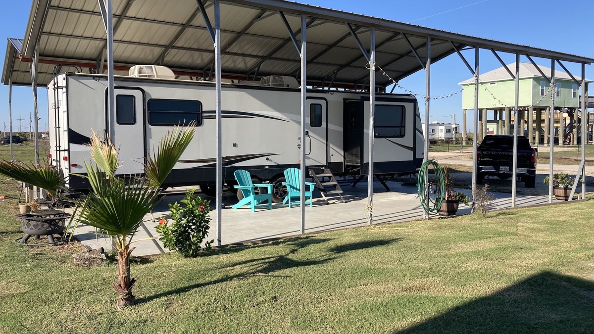 Port Bolivar House | 10 minutes walk to the beach .Covered rv spot on concrete slab. NEW CAMPER