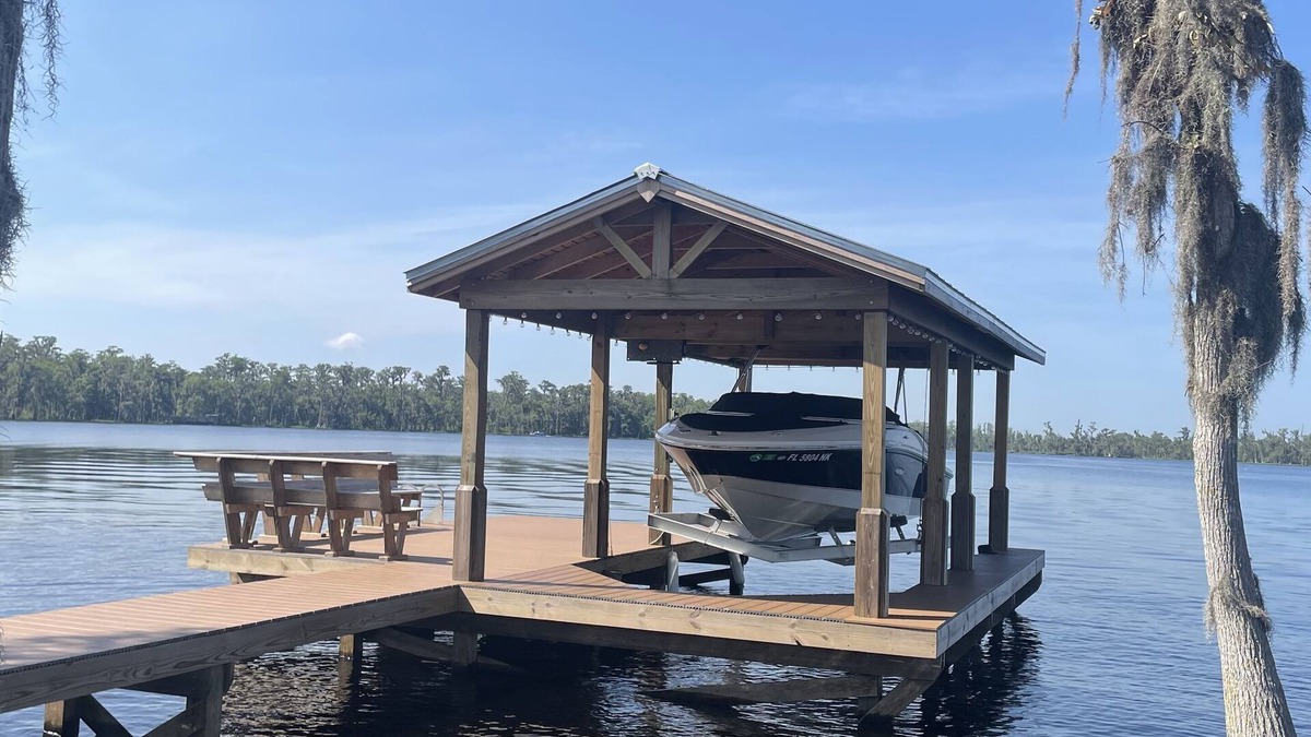 Clermont House | 2 bed 2 bath on Clermont chain of lakes with dock & boat lift Emerald Lakes 55+