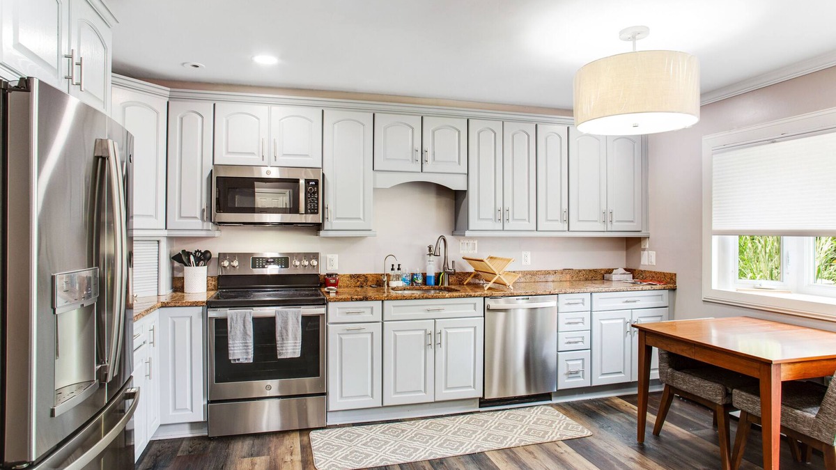 Edgewater House | 2-story, riverfront home with private dock, inviting deck & dog-friendly yard