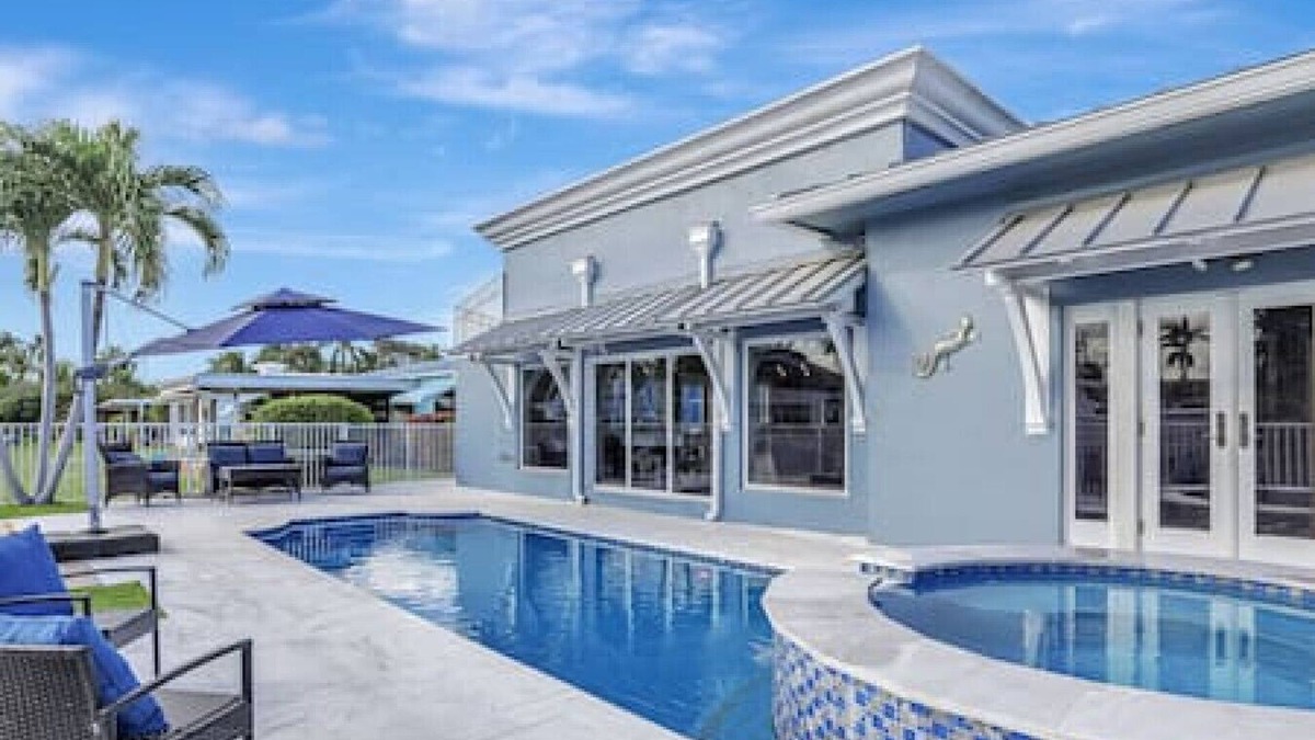 South New River Isles House | 3BR Waterfront Villa with Heated Pool, Spa, & Rooftop Deck