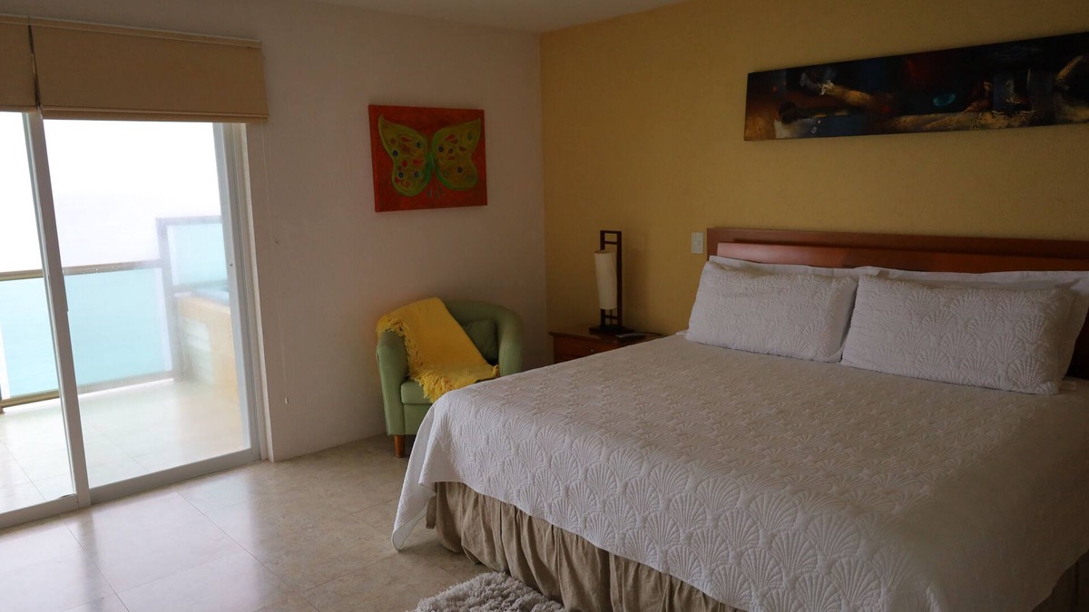 Colonos Cuzamil Condo | 4/4.5 Condo Oceanfront Cozumel Downtown AC WiFi Security
