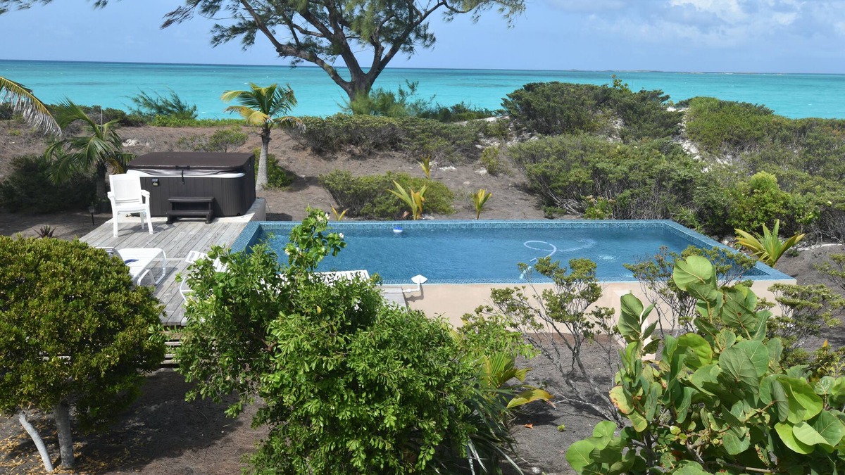 Great Exuma House | 4acres ON beach no drive 4 bedroom pool hot tub gym 3.5 baths 3+3outdoor showers