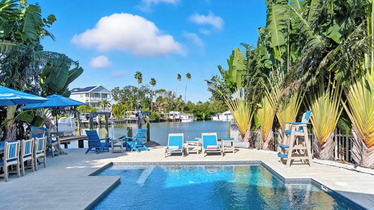 Indian Rocks Beach House | 5 Bed WTFT heated pool dock 6 seat golf cart