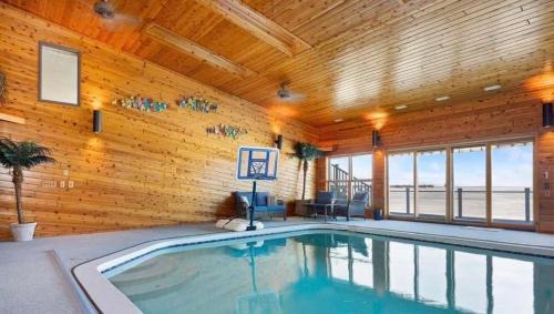 Prudenville House | 6BR Houghton Lake House with Indoor Pool, Hot Tub and Golf Simulator