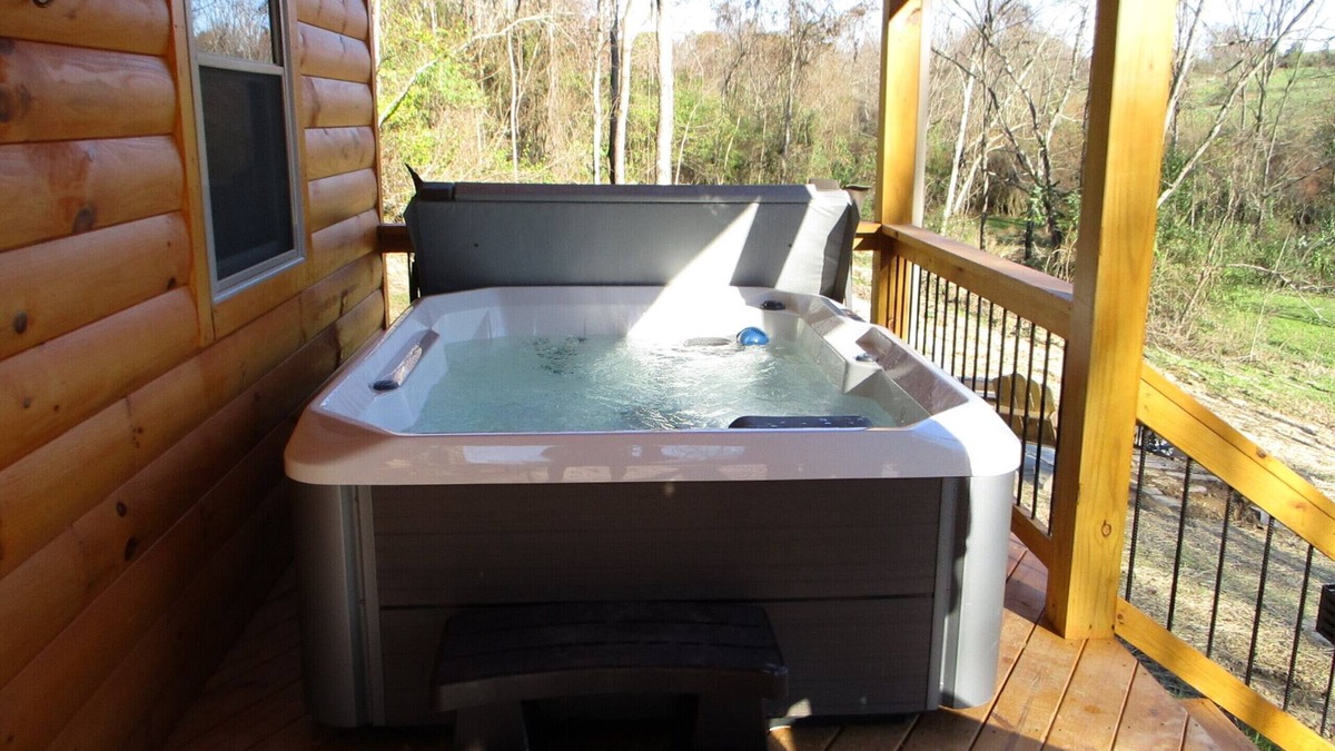 Carbon Hill Cabin | A cozy new cabin in rural setting with a hot tub on porch. Beautiful rural view.
