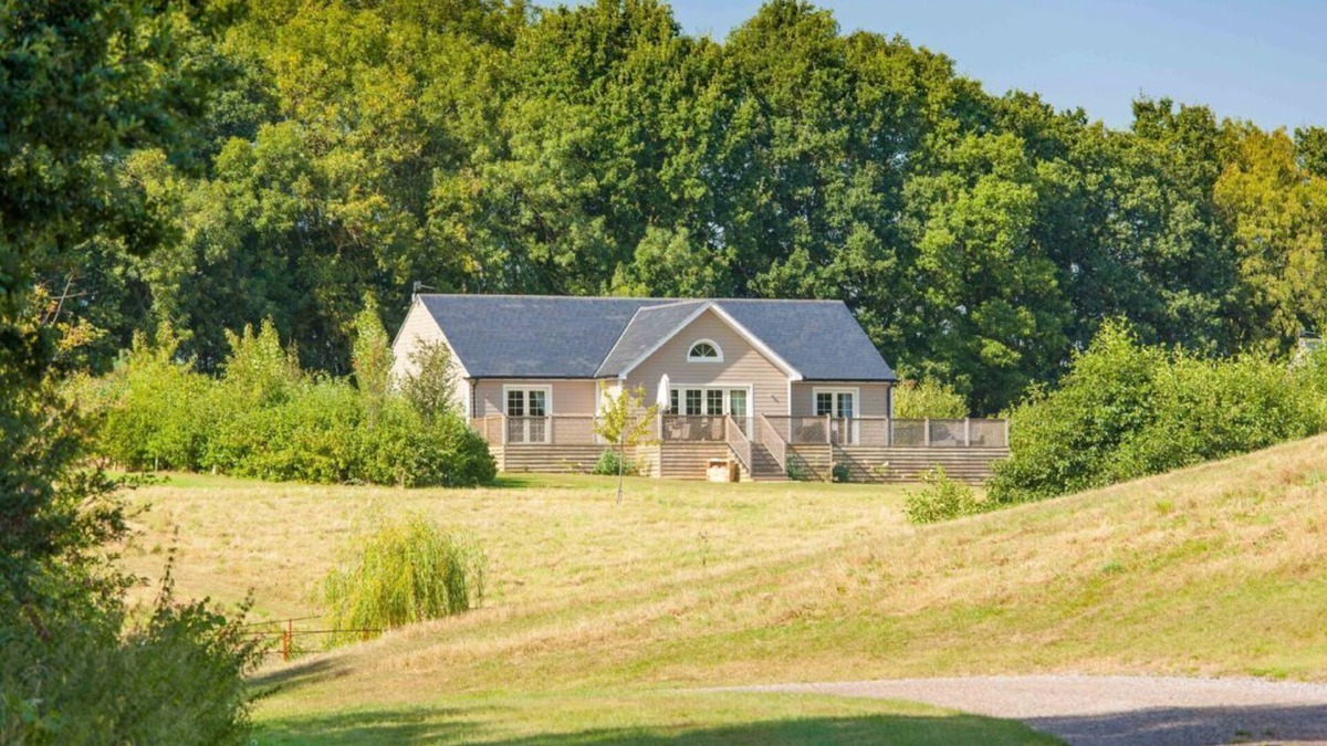 Pattiswick Cabin | A delightful lodge with hot tub on Wakes Hall Farm is a haven of peace in 500 acres of private land