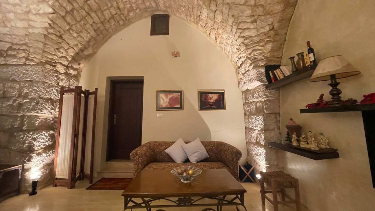 Damour House | A renovated historic rock house with two vaults