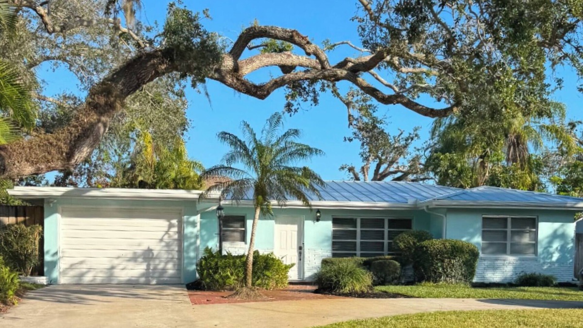 Central Beach House | A tropical retro bungalow secluded area with terrazzo flooring & heated pool.