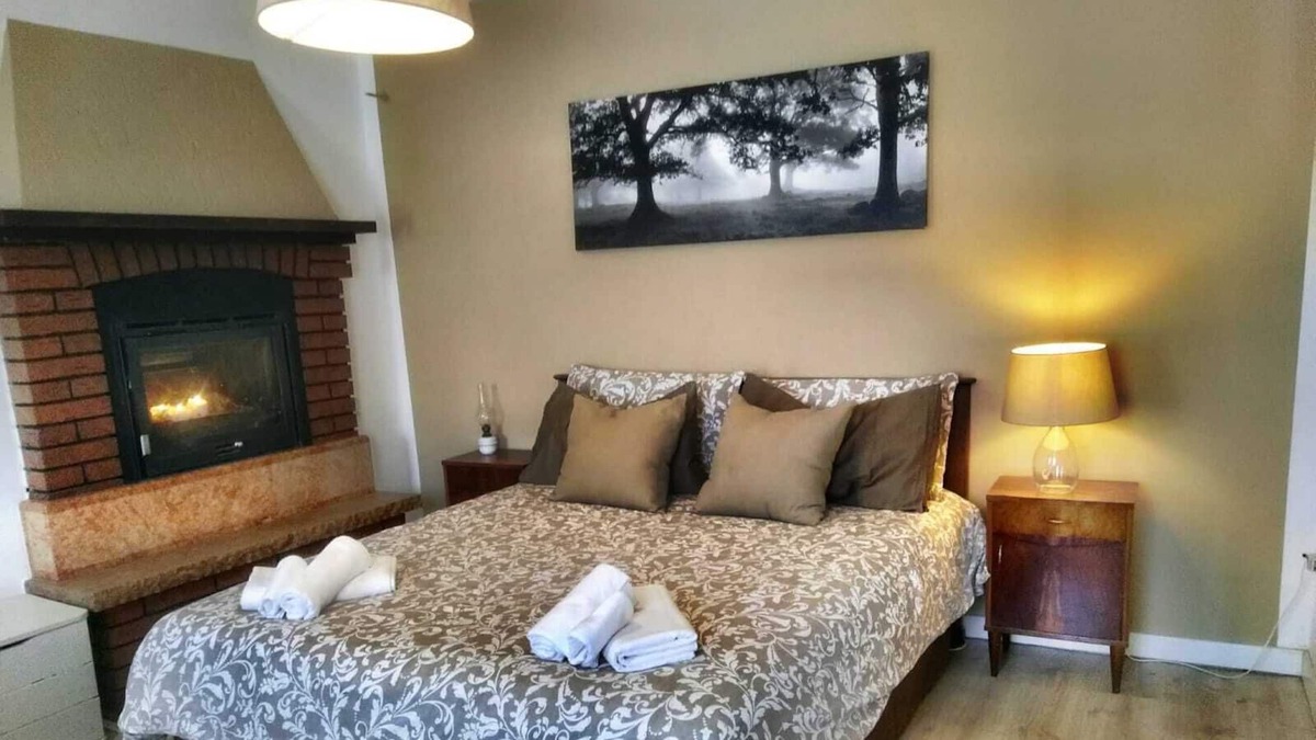 Salcedo Apartment | A Warm Refuge in front of the Wood - A quiet Retreat