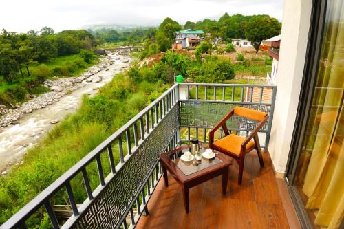 Sheehla Hotel | Aachman River and Valley View Resort Dharamshala - A riverside resort with balcony view