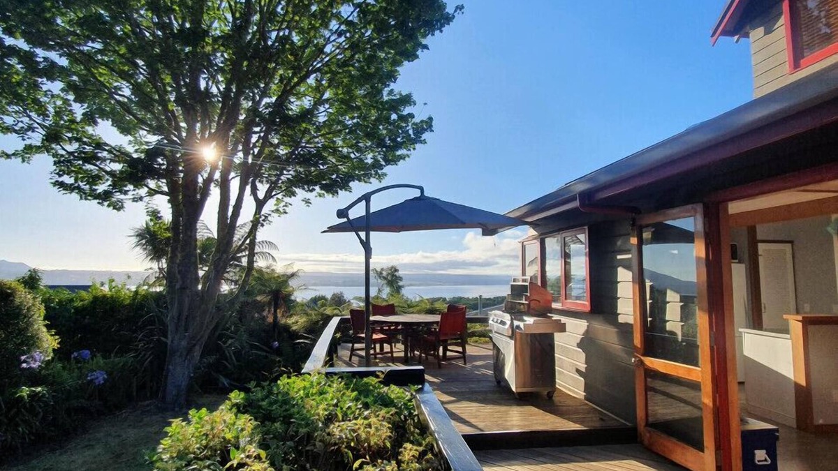 Acacia Bay House | Acacia Bay Retreat | Stylish Family Getaway with Fireplace & Lake Views