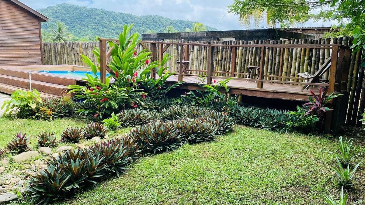 Dangriga Cabin | Aly's Valley Cabin, a private cabin in a village with a mountain view.
