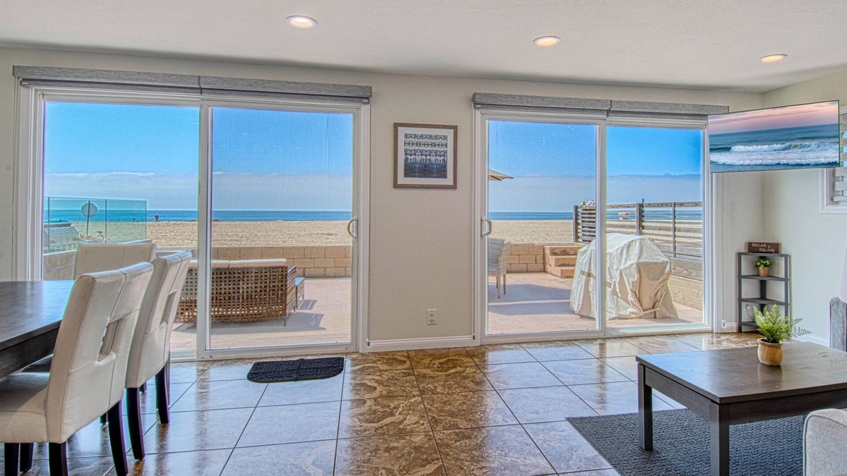 West Newport Condo | Amazing location with an amazing, newly-remodeled lower unit right on the sand!
