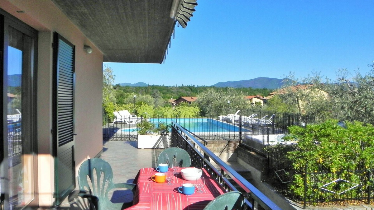 Manerba del Garda Apartment | Apartment with swimming pool and soccer field parking lot with gate