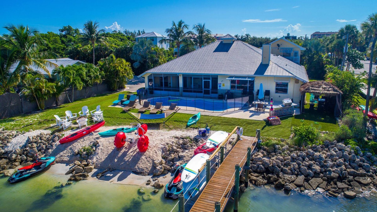 Stuart House | Aquatopia South: Riverfront Beach House, Steps 2 Ocean. Heated Pool & Dock!