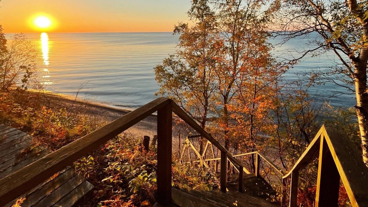 Laurium House | **Artistry view of Lake Superior with the allurement of Upper Entry Lighthouse *