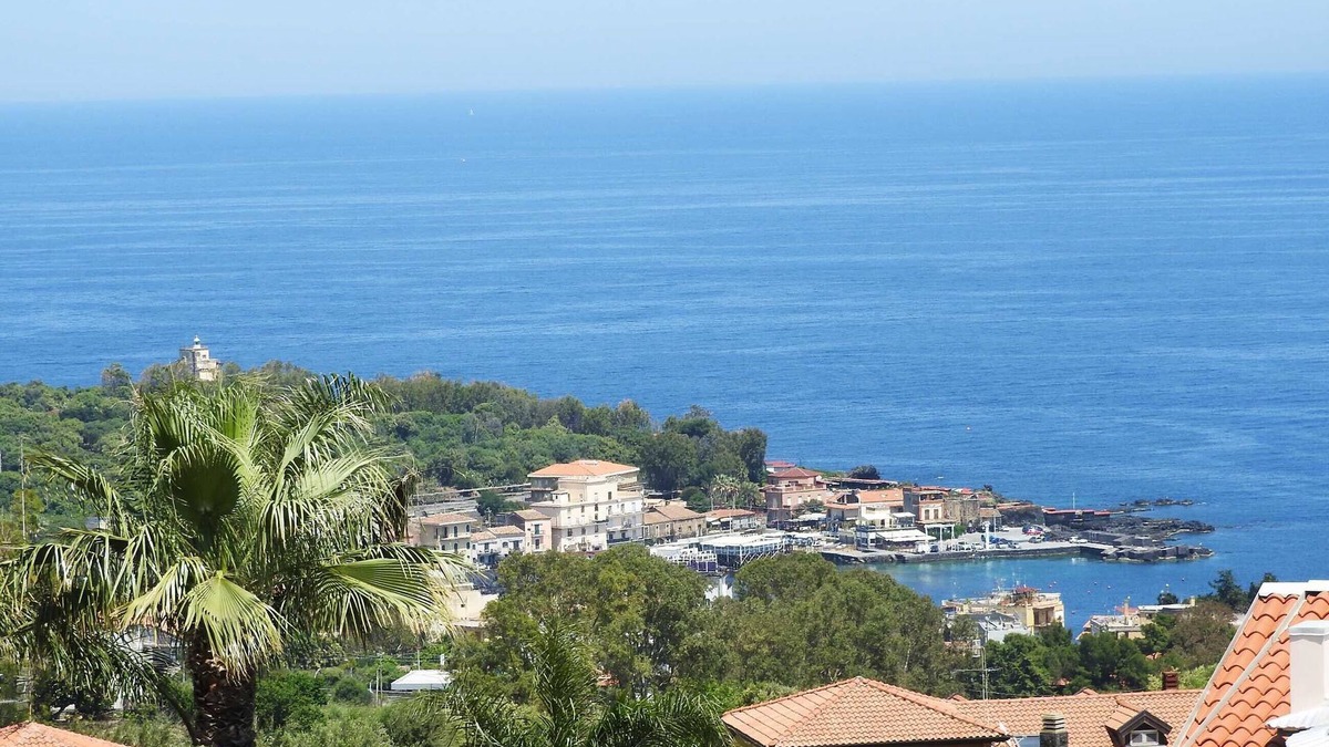 Aci Catena Apartment | Attic overlooking the sea of the Cyclops