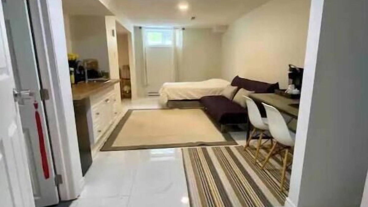 Aylmer House | Basement studio with an attached private bathroom and parking.