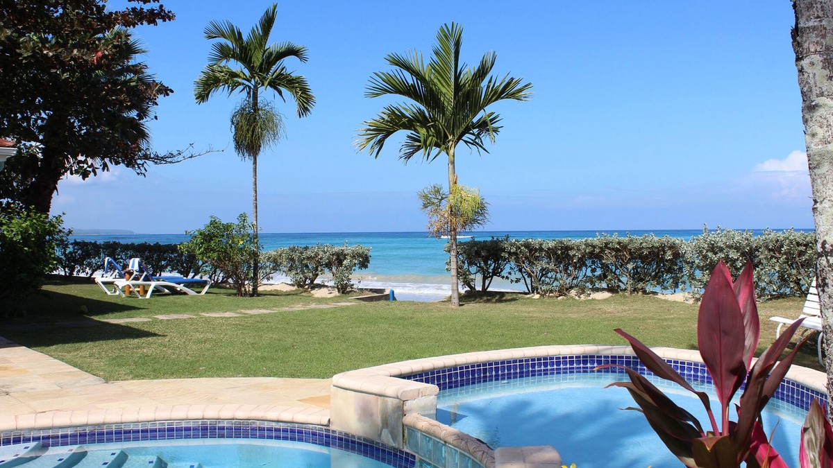 Runaway Bay Villa | Baywatch - seaside villa, modern, spectacular location & garden, pool, cook
