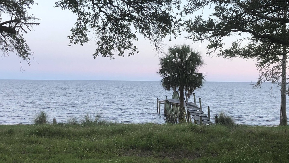 Carrabelle House | Beach house sleeps 12 people. Watch the ocean and sunrise at the front patio.
