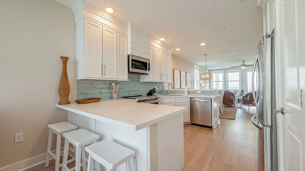 Red Fish Cove Condo | BEACHFRONT BLISS! Open Kitchen and Dining-Community Pools-Bunk Room-Balcony