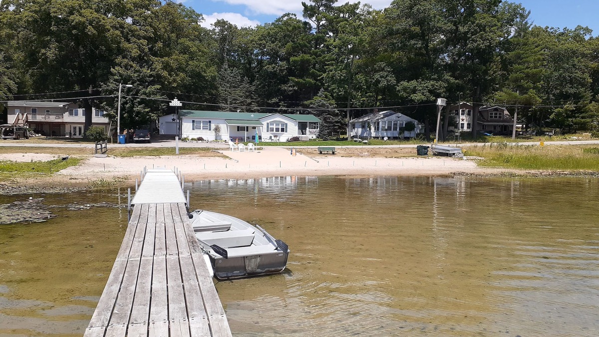 Fountain House | Beachfront retreat on beautiful Tallman lake near HuronManistee National Forest.