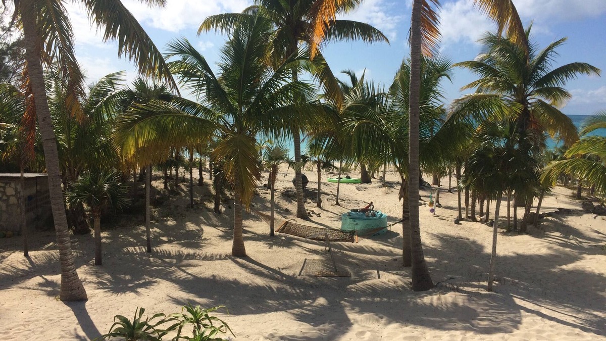Old Bight House | Beachfront views of pristine sandy beach, clear blue waters and surreal sunsets.