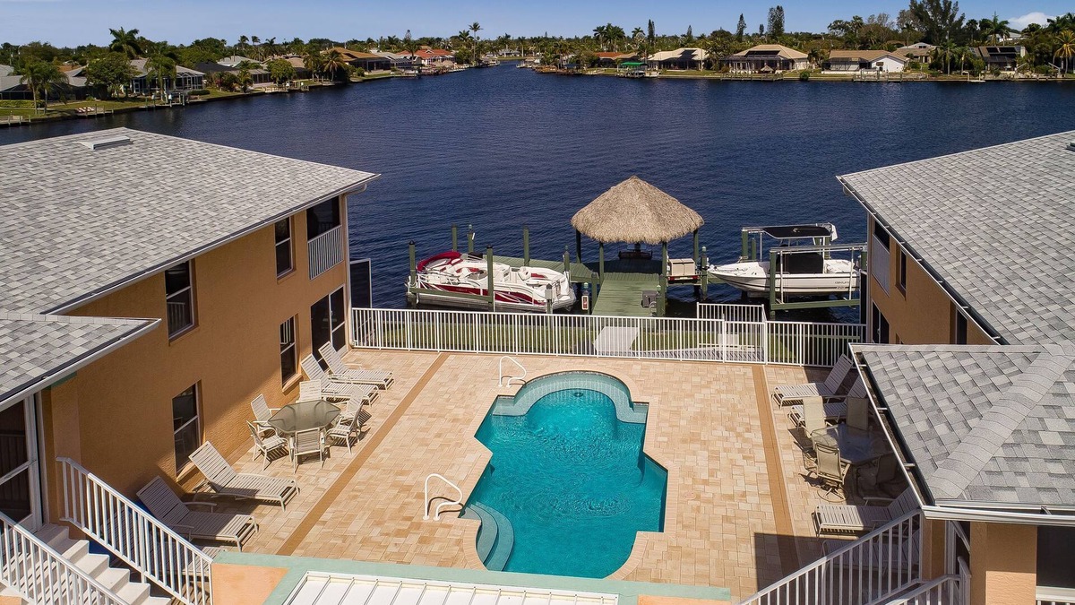 Pelican Apartment | Beautiful 4 unit building on Lake Louise with a private pool.