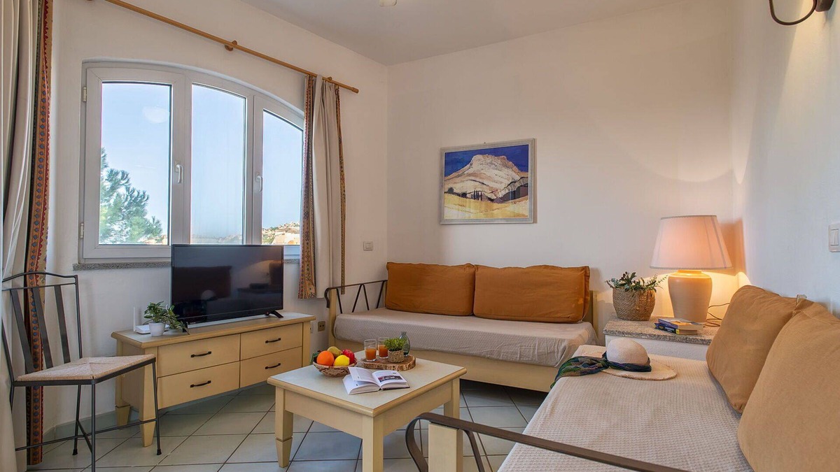 Canneddi Apartment | Beautiful apartment for 4 people with A/C, WIFI, pool, TV, terrace, pets allowed and parking