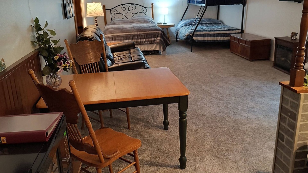 Shore House | Beautiful cabin situated on wooded land with nice yard clearing and small stream