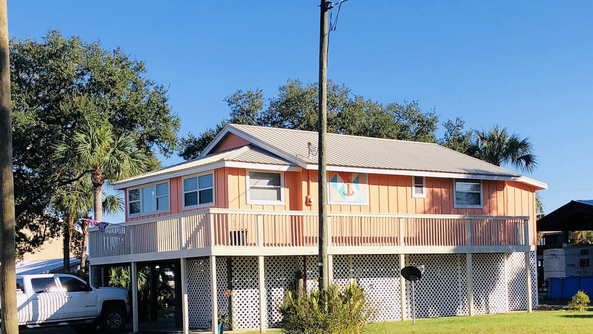 Horseshoe Beach House | Beautiful Canal Front, Nautical Theme Home with downstairs outdoor TIki Bar