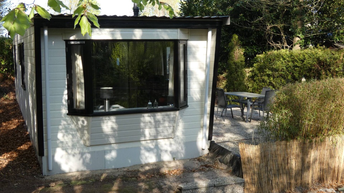 Marum Ski Chalet | Beautiful chalet for rent overlooking ornamental pond against forest + parking lot