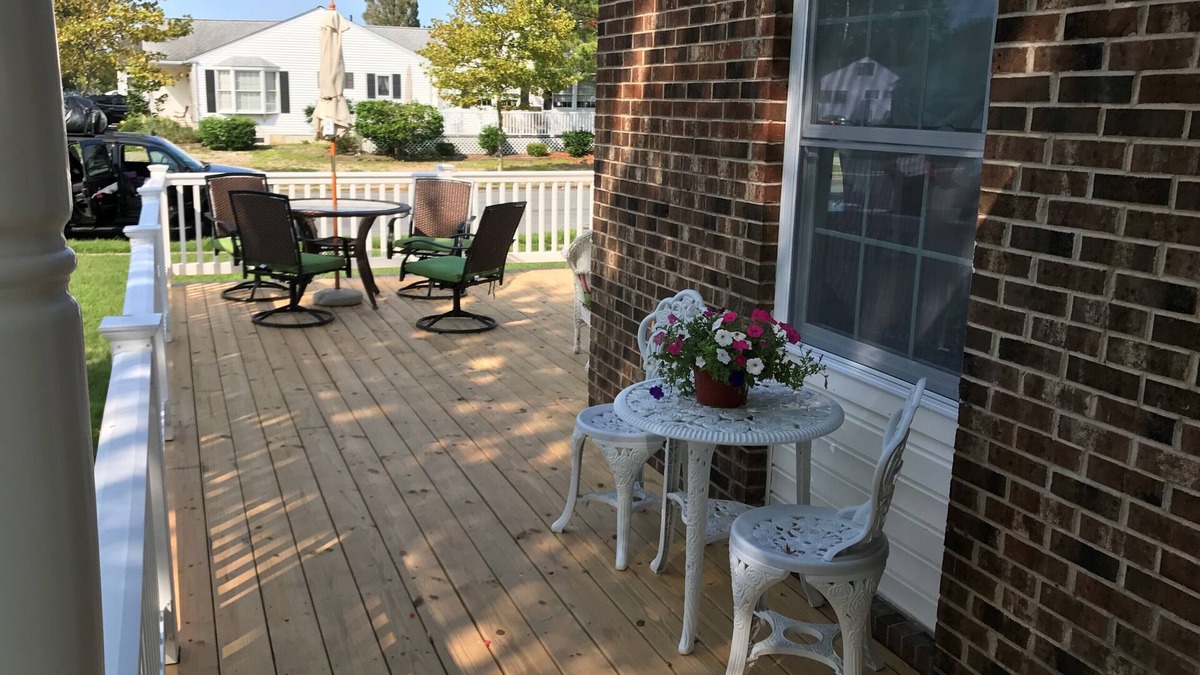 Village Green House | Beautiful corner property with cozy beach vibe.