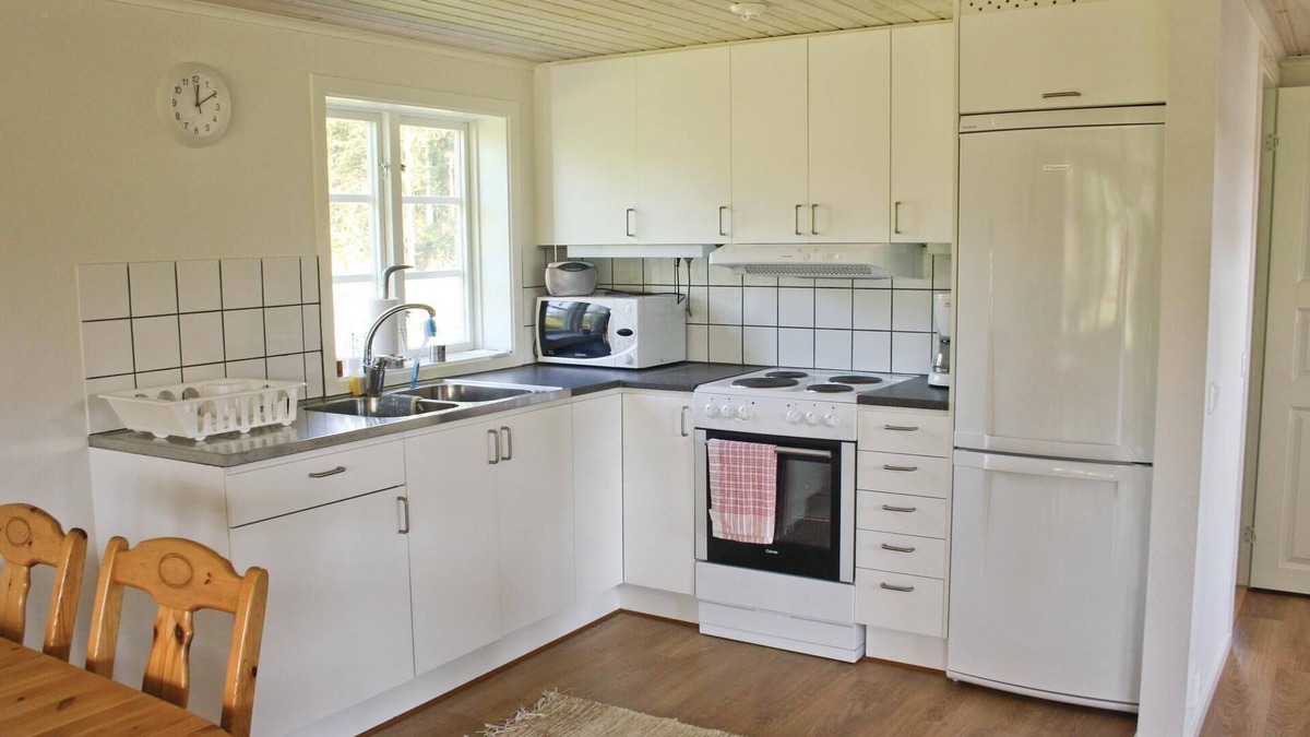 Vittsjo House | Beautiful cottage with fireplace for cool evenings.