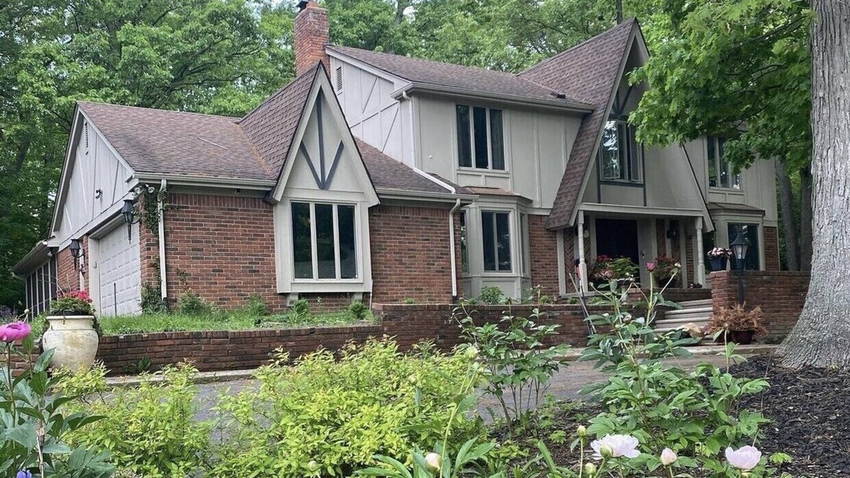 Farmington Hills House | Beautiful English Farmhouse Tudor, situated on a lush hillside acre.