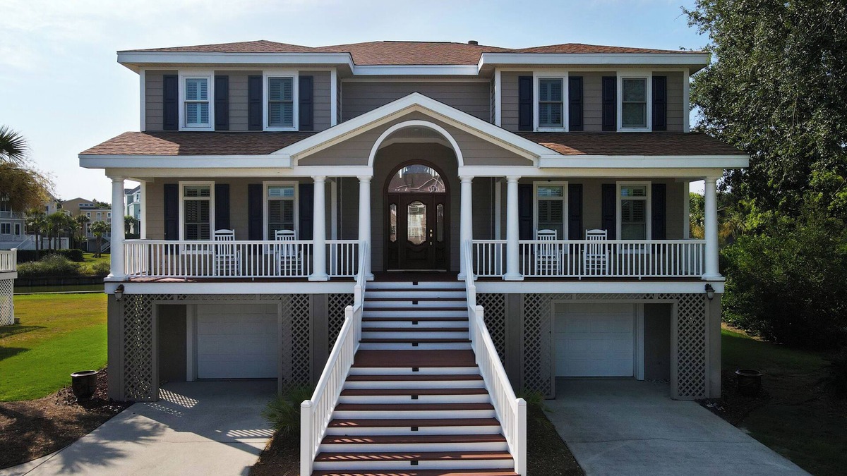 Ocean Point House | Beautiful home with open porches overlooking lagoon in Wild Dunes