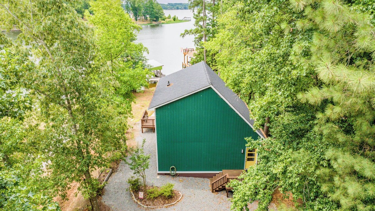 North Shore Acres House | Beautiful lake front cottage, deep water lot with covered dock and amenities.