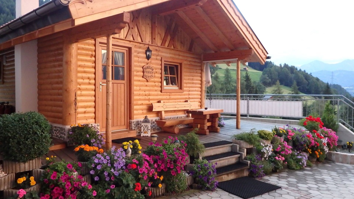 Fendels Apartment | Beautiful wooden hut with a cozy fireplace, stone pine parlor and stone pine bed