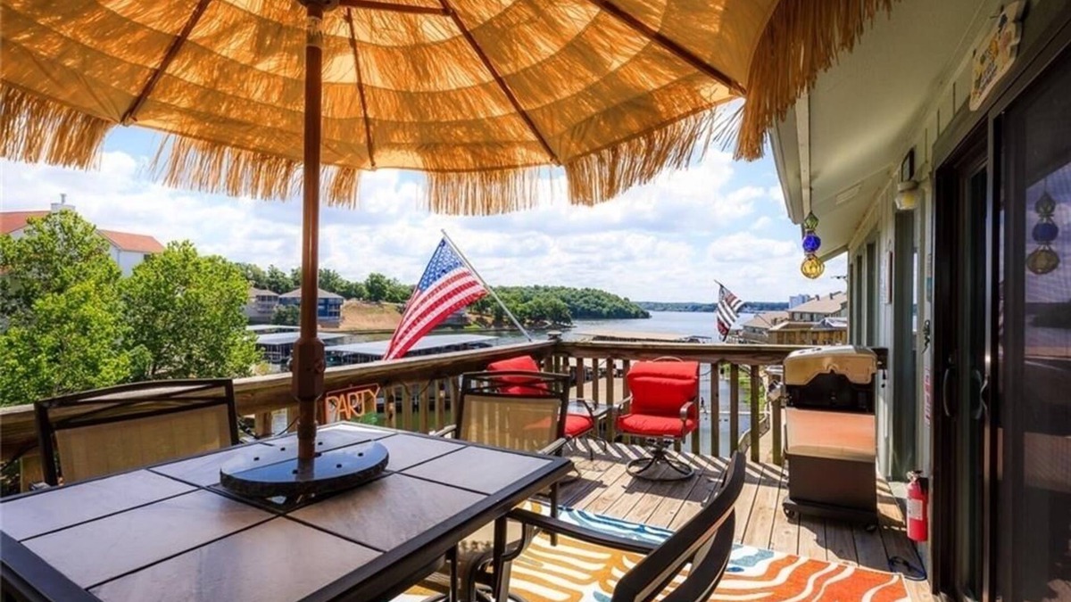 Lake Ozark Condo | BEAUTIFULLY UPDATED LAKEFRONT CONDO & OVERSIZED DECK, WI-FI, 2 Pools, hot tub.