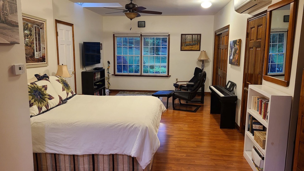 Redding Ridge Apartment | Bedroom, bathroom with beautiful shower, second room with work or eating area.