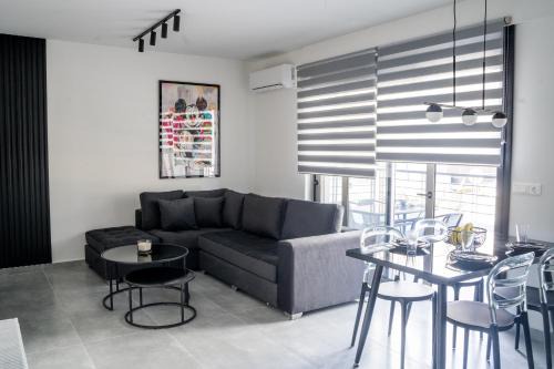 Ilisia Apartment | Black & White 2BR Apt steps from Mavili Square