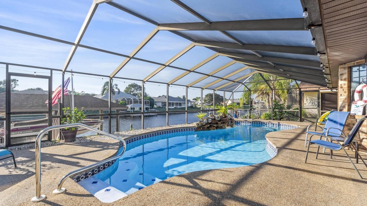 Palm Harbor House | Blue Haven Large Waterfront Pool Home | Boat Dock | Canal | Water Views | Pool Bar | WIFI | Fishing