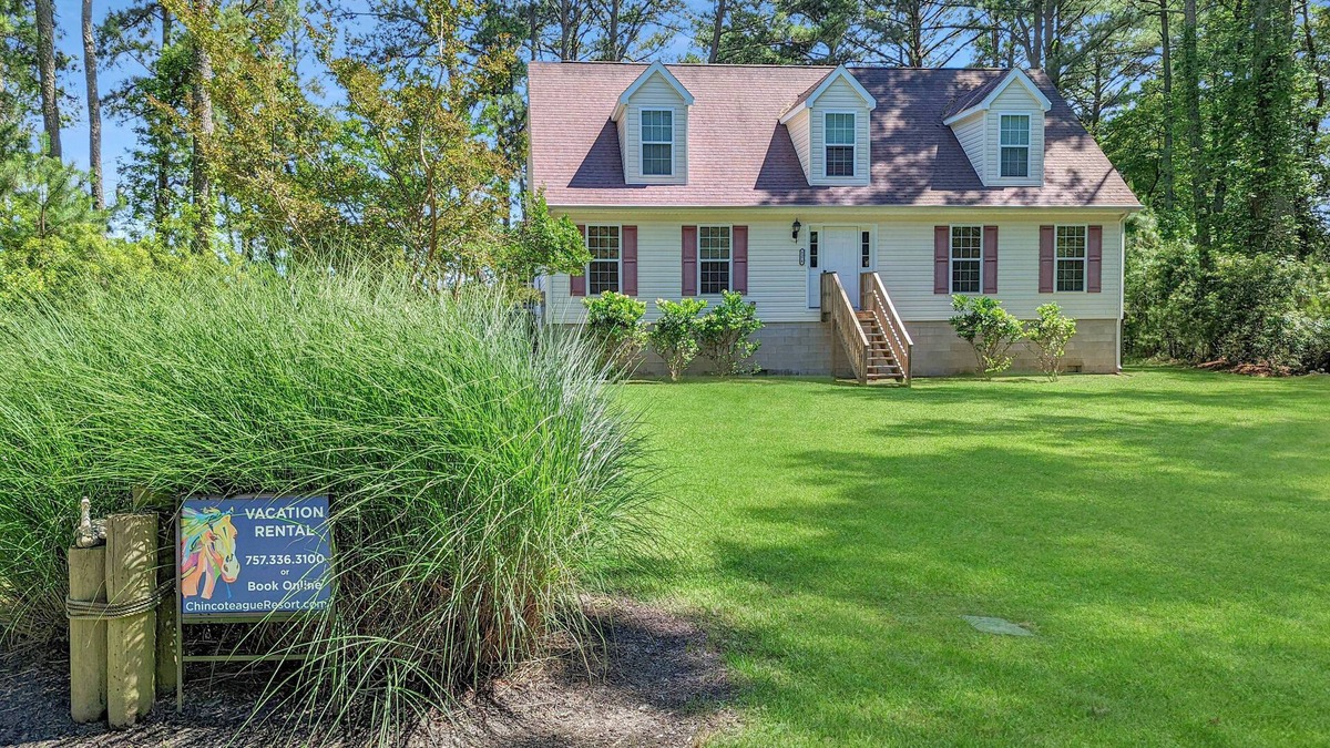 Piney Island House | Blue Heron, modern beach retreat with outdoor shower and screened porch