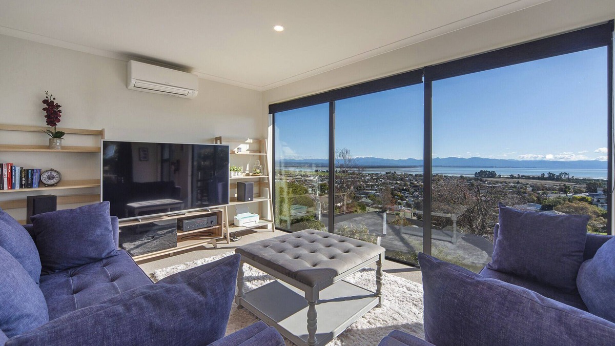 Tahunanui House | Blue Water Views - Modern, Sun-filled & Offers Fantastic Views over Tasman Bay.