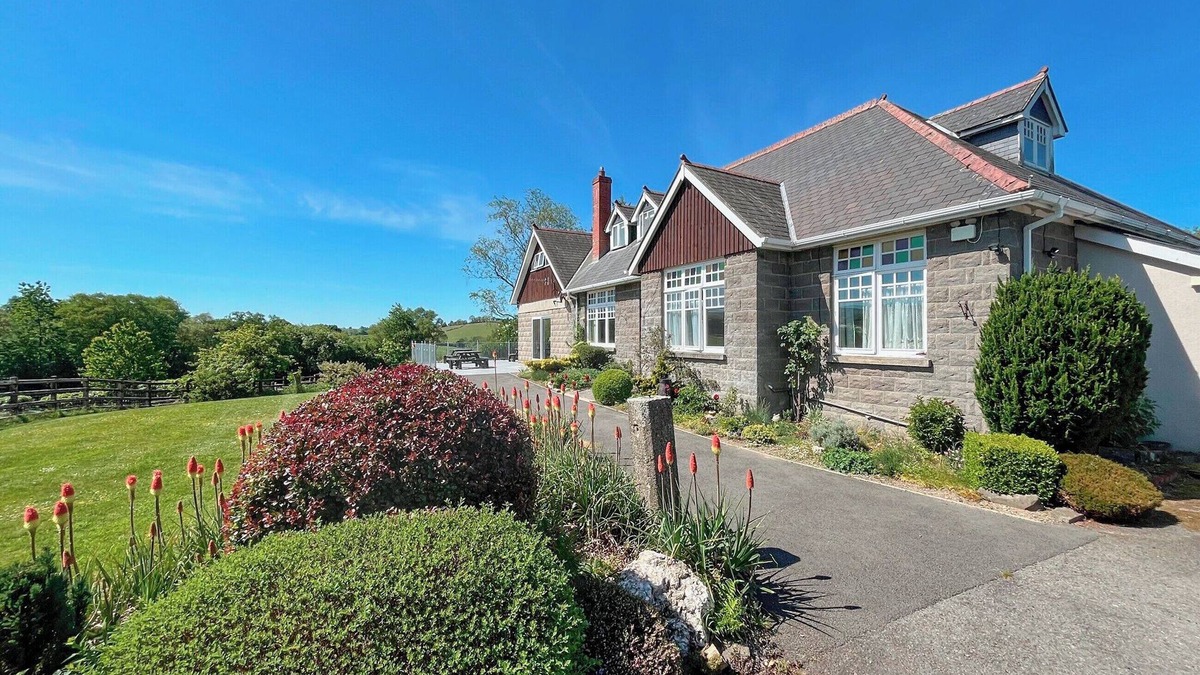Tregaron Cottage | Boasting panoramic views, set in 15 acres, with open water lake and river.