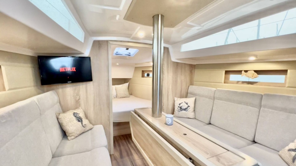 Ostholstein Boat Rental | Boat 'Hausboot Segelyacht Nui' on the sea and Private Terrace