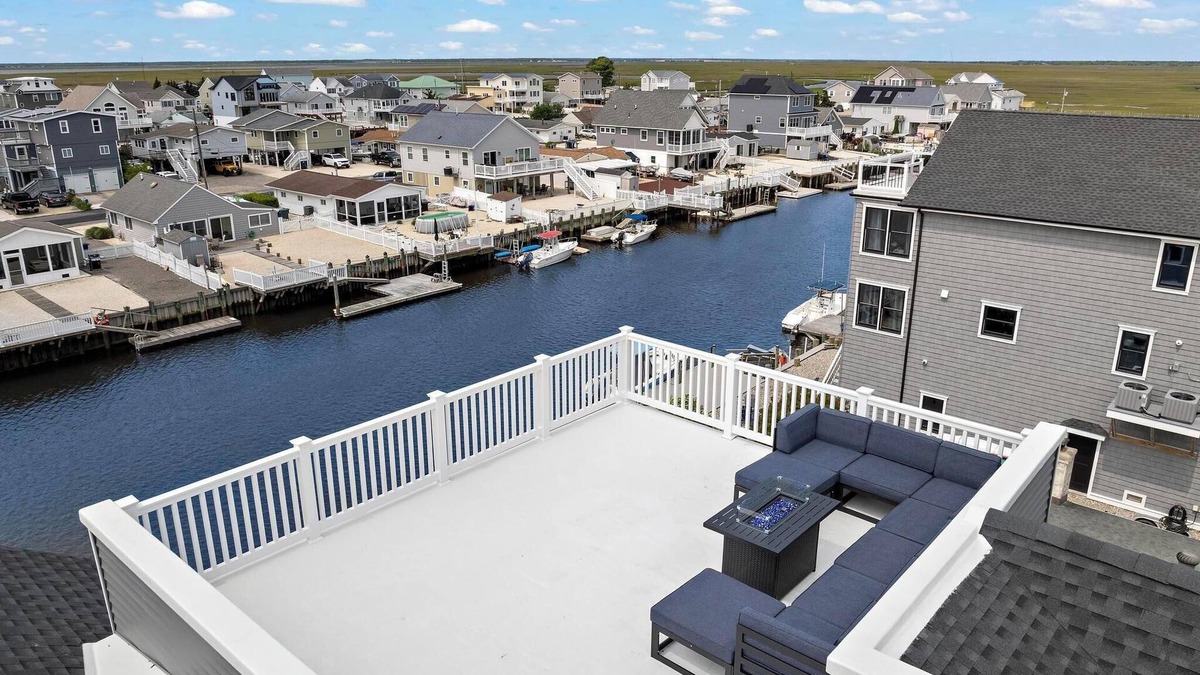 Mystic Island House | Brand New, Waterfront Beach Oasis with Heated Pool, Hot Tub, & Dock close to LBI