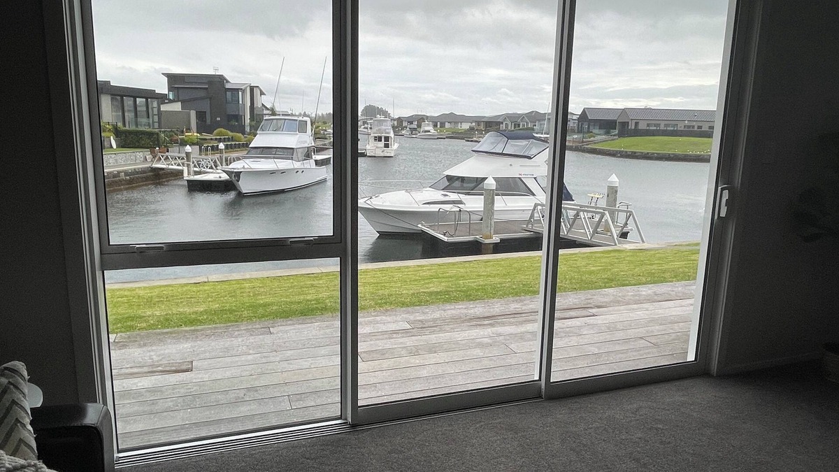 One Tree Point House | Brand new canal-front holiday home, stunning water views, private boat ramp.