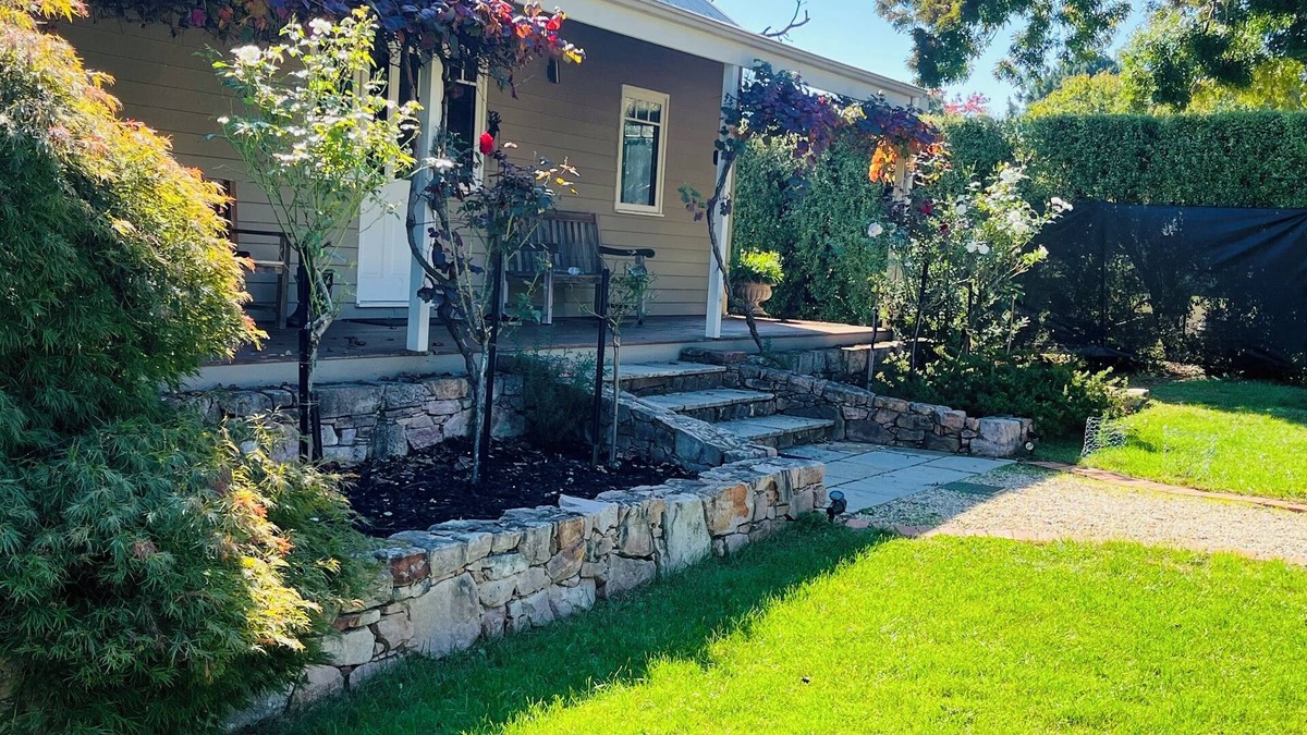 Wandiligong House | *BRIGHT*, Modern Home with large outdoor deck and outside fireplace.